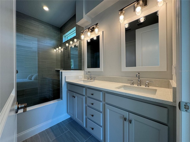 1665 Lake Reserve Dr, Deland, FL 32724 - full bath with double vanity, a tile shower, and baseboards
