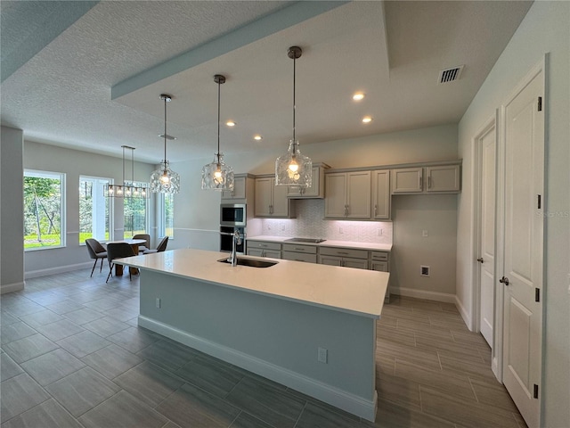 1665 Lake Reserve Dr, Deland, FL 32724 - kitchen featuring a sink, gray cabinetry, recessed lighting, baseboards, and a kitchen island with sink