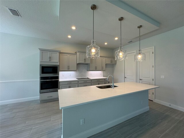 1665 Lake Reserve Dr, Deland, FL 32724 - kitchen featuring oven, a sink, gray cabinetry, baseboards, and recessed lighting