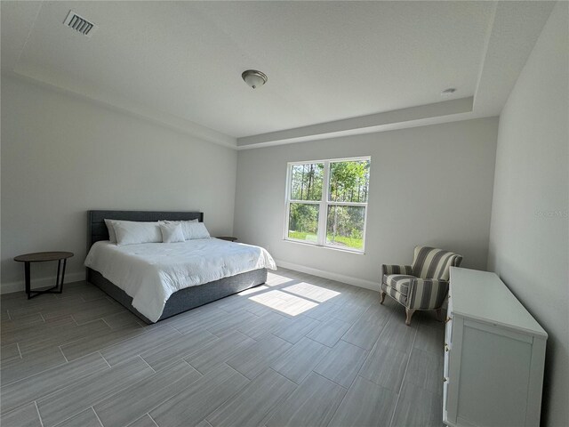 1665 Lake Reserve Dr, Deland, FL 32724 - bedroom featuring baseboards and wood tiled floors