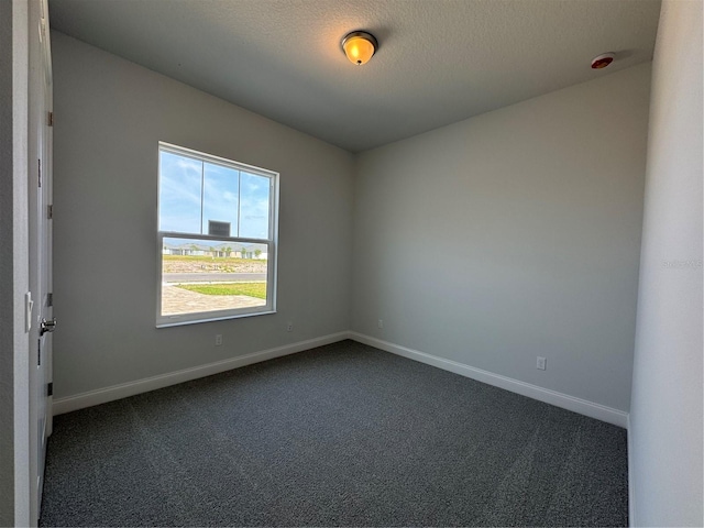 1665 Lake Reserve Dr, Deland, FL 32724 - empty room featuring dark colored carpet and baseboards