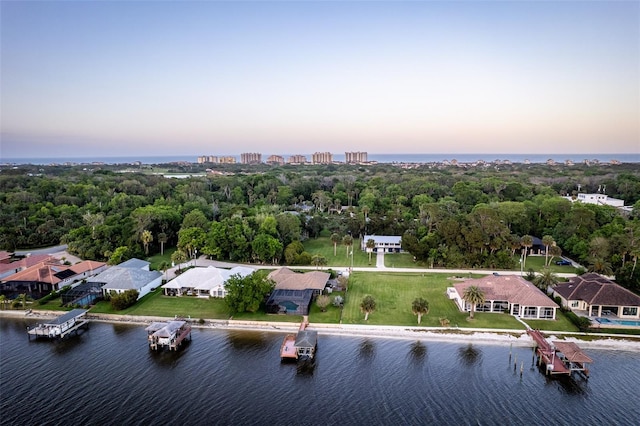 aerial view at dusk with a water view