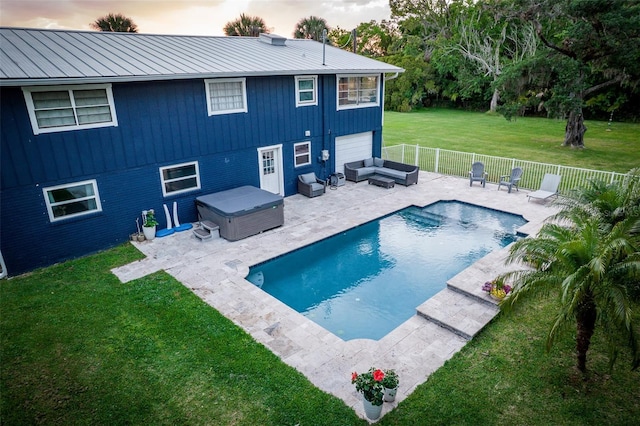 view of swimming pool with a hot tub, a lawn, a fenced backyard, an outdoor living space, and a patio