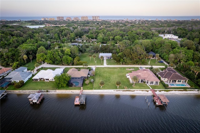 birds eye view of property with a water view