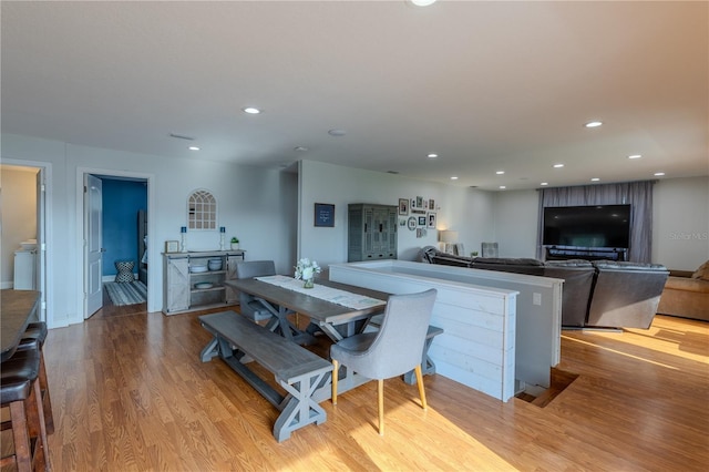 dining area featuring recessed lighting and wood finished floors