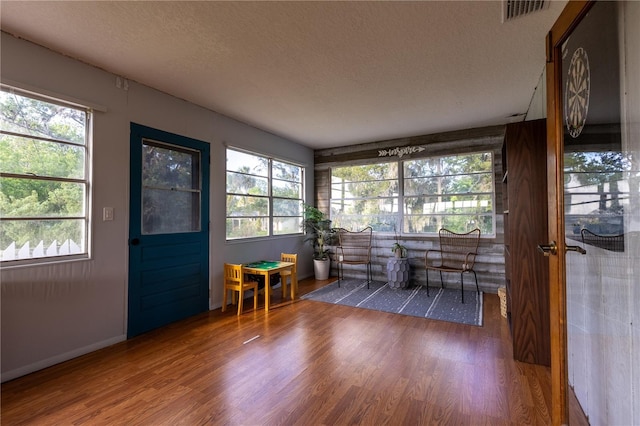 sunroom / solarium featuring visible vents
