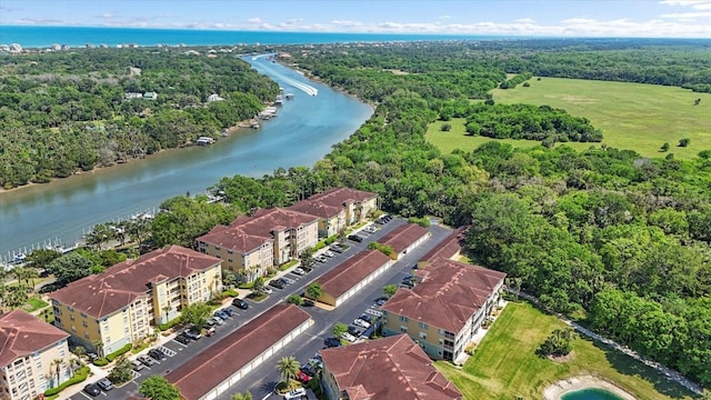 bird's eye view of a nearby body of water and a forest