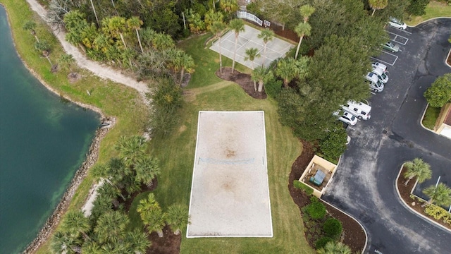 aerial view of property and surrounding area featuring a nearby body of water