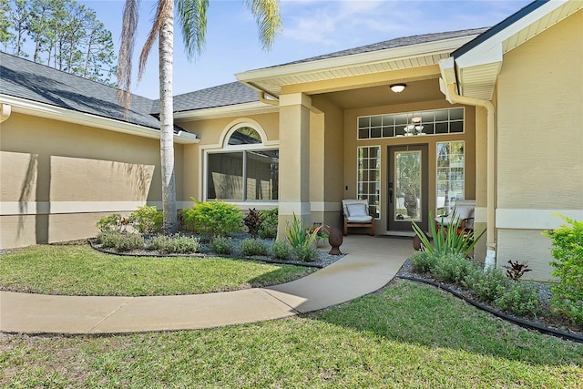 65 Esperanto Dr, Palm Coast, FL 32164 - doorway to property with a yard, a shingled roof, and stucco siding