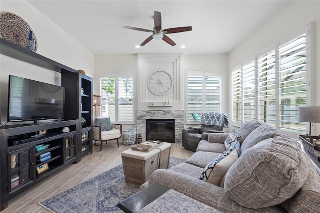 65 Esperanto Dr, Palm Coast, FL 32164 - living area with wood finished floors, a fireplace, recessed lighting, and ceiling fan