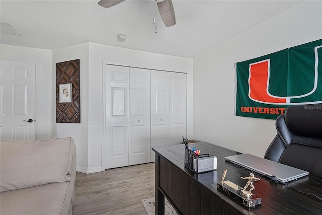 65 Esperanto Dr, Palm Coast, FL 32164 - office area with light wood finished floors, visible vents, a ceiling fan, baseboards, and a textured ceiling