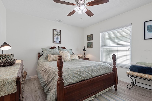 65 Esperanto Dr, Palm Coast, FL 32164 - bedroom featuring baseboards, a ceiling fan, wood finished floors, and visible vents