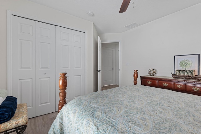65 Esperanto Dr, Palm Coast, FL 32164 - bedroom with visible vents, a ceiling fan, wood finished floors, and a closet