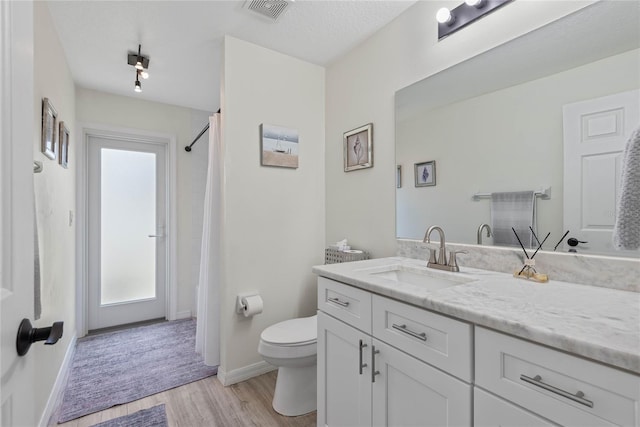 65 Esperanto Dr, Palm Coast, FL 32164 - full bathroom with wood finished floors, visible vents, vanity, and a healthy amount of sunlight