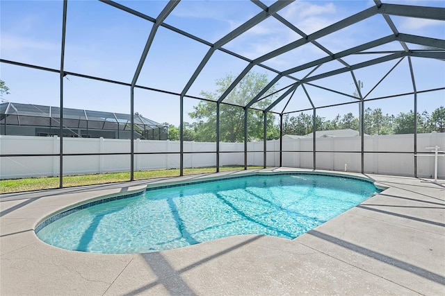 65 Esperanto Dr, Palm Coast, FL 32164 - view of swimming pool with glass enclosure, a patio area, a fenced in pool, and a fenced backyard