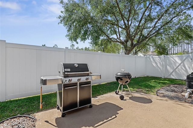 65 Esperanto Dr, Palm Coast, FL 32164 - view of patio with a grill and fence private yard