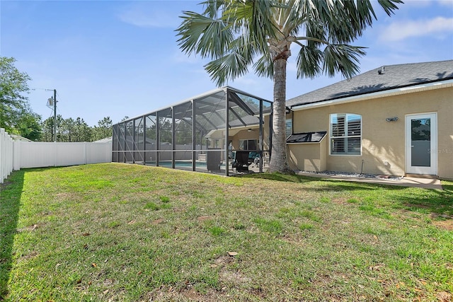 65 Esperanto Dr, Palm Coast, FL 32164 - view of yard with a fenced backyard, a fenced in pool, glass enclosure, and a patio