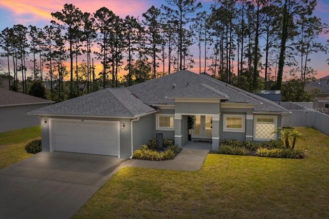 40 Woodborn Ln, Palm Coast, FL 32164 - view of front facade with a shingled roof, a garage, concrete driveway, and stucco siding