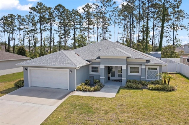 40 Woodborn Ln, Palm Coast, FL 32164 - view of front of property with a garage, a shingled roof, driveway, french doors, and stucco siding