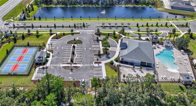 birds eye view of property with a water view