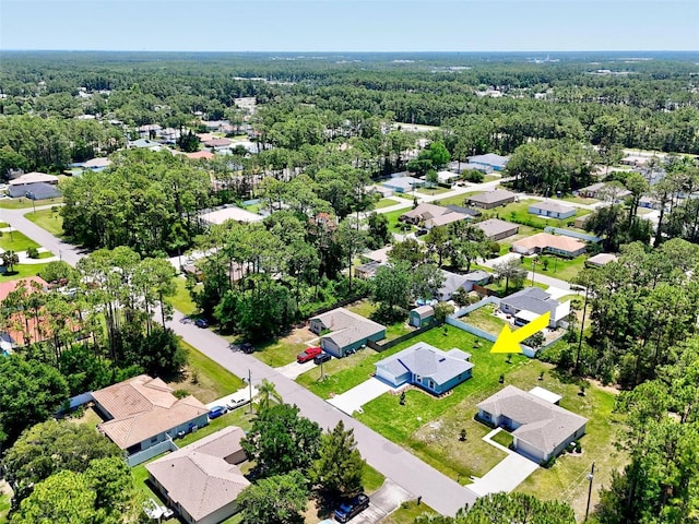 55 Ryan Dr, Palm Coast, FL 32164 - aerial perspective of suburban area featuring a heavily wooded area