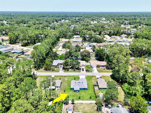 55 Ryan Dr, Palm Coast, FL 32164 - aerial view of property's location featuring a heavily wooded area and nearby suburban area