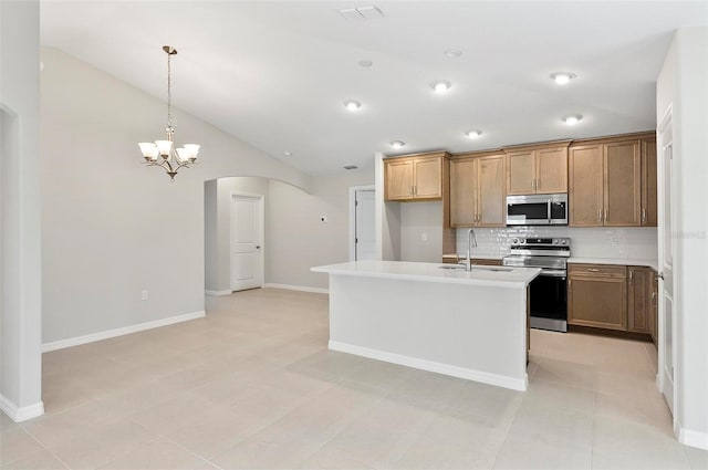 55 Ryan Dr, Palm Coast, FL 32164 - kitchen featuring appliances with stainless steel finishes, arched walkways, a sink, backsplash, and lofted ceiling