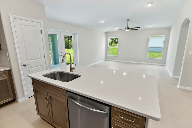 55 Ryan Dr, Palm Coast, FL 32164 - kitchen featuring dishwasher, a sink, an island with sink, open floor plan, and light countertops