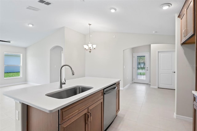 55 Ryan Dr, Palm Coast, FL 32164 - kitchen with dishwasher, a sink, light countertops, and arched walkways