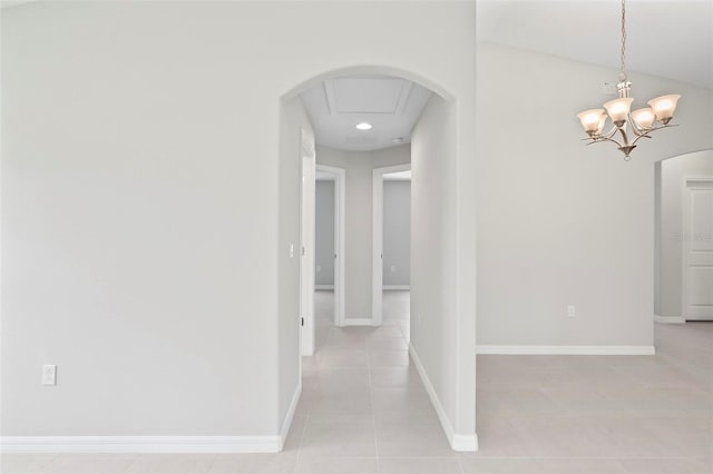 55 Ryan Dr, Palm Coast, FL 32164 - hall featuring light tile patterned floors, arched walkways, recessed lighting, and baseboards