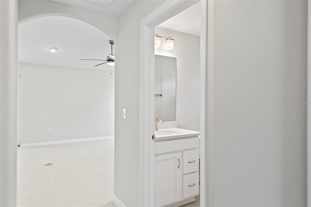 55 Ryan Dr, Palm Coast, FL 32164 - bathroom with vanity, a ceiling fan, and tile patterned floors