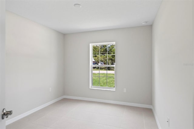 55 Ryan Dr, Palm Coast, FL 32164 - empty room featuring light tile patterned floors and baseboards