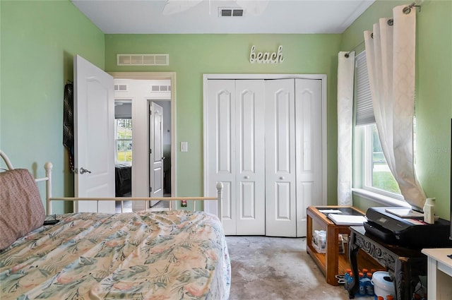 47 Raleigh Dr, Palm Coast, FL 32164 - bedroom with visible vents, concrete flooring, and a closet