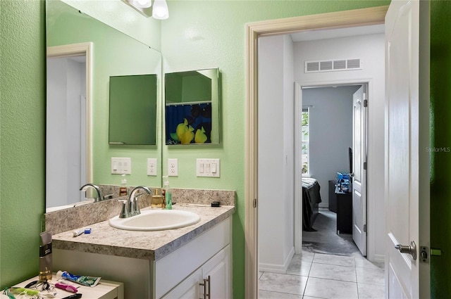 47 Raleigh Dr, Palm Coast, FL 32164 - bathroom with vanity, visible vents, and tile patterned floors