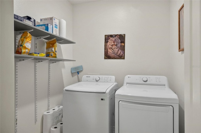 47 Raleigh Dr, Palm Coast, FL 32164 - clothes washing area featuring laundry area and washing machine and dryer