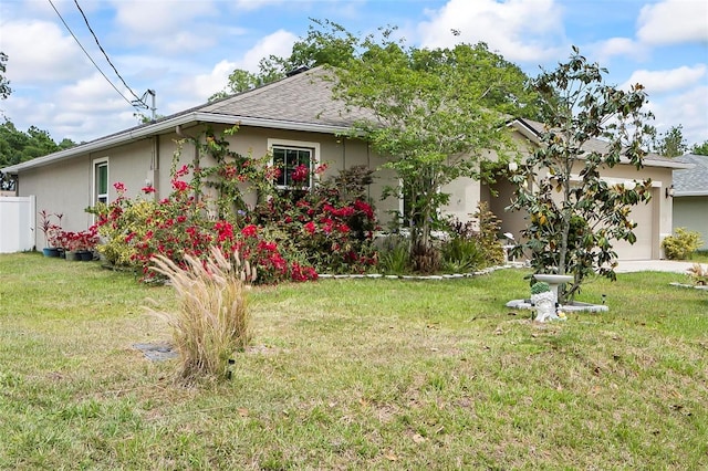 47 Raleigh Dr, Palm Coast, FL 32164 - exterior space featuring stucco siding, a lawn, a shingled roof, and an attached garage
