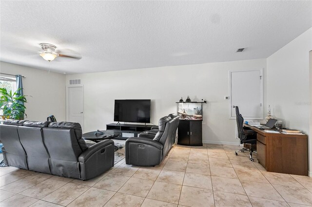47 Raleigh Dr, Palm Coast, FL 32164 - living room featuring visible vents, light tile patterned floors, and a textured ceiling