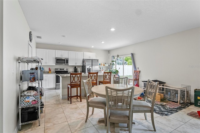 47 Raleigh Dr, Palm Coast, FL 32164 - dining area featuring light tile patterned floors, recessed lighting, and visible vents