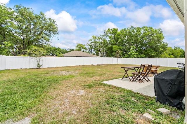 47 Raleigh Dr, Palm Coast, FL 32164 - view of yard with a fenced backyard and a patio area