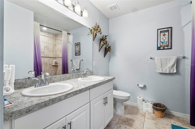 47 Raleigh Dr, Palm Coast, FL 32164 - bathroom with toilet, a sink, baseboards, and visible vents