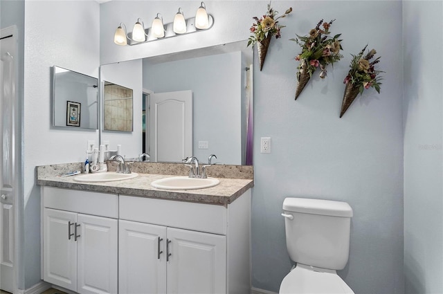 47 Raleigh Dr, Palm Coast, FL 32164 - full bathroom with double vanity, toilet, and a sink