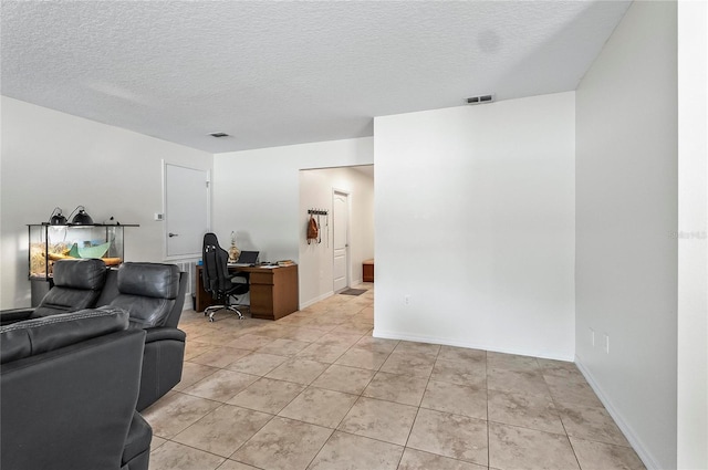 47 Raleigh Dr, Palm Coast, FL 32164 - living area featuring light tile patterned floors, visible vents, and a textured ceiling