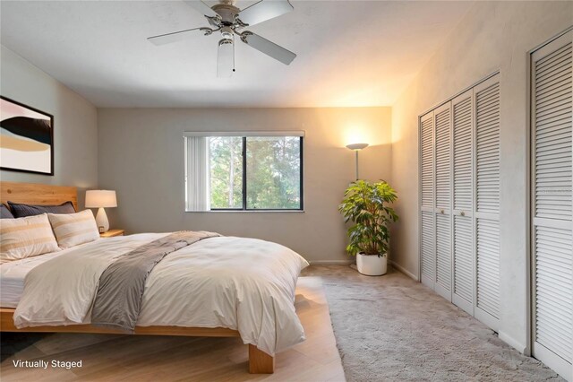 140 Limewood Pl Unit 2, Ormond Beach, FL 32174 - bedroom with multiple closets, baseboards, and ceiling fan
