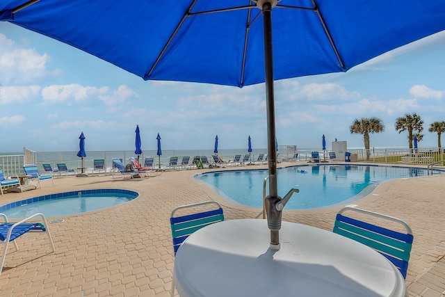 1155 Ocean Shore Blvd Unit 702, Ormond Beach, FL 32176 - community pool featuring fence and a patio area