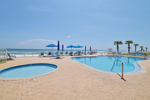 1155 Ocean Shore Blvd Unit 702, Ormond Beach, FL 32176 - pool featuring a patio area, a water view, and fence