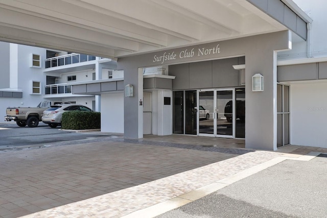 1155 Ocean Shore Blvd Unit 702, Ormond Beach, FL 32176 - entrance to property with stucco siding and french doors