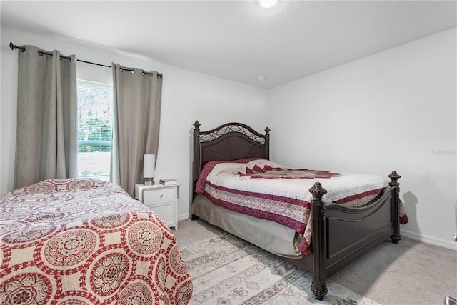64 Princess Ruth Ln, Palm Coast, FL 32164 - bedroom with light colored carpet and baseboards
