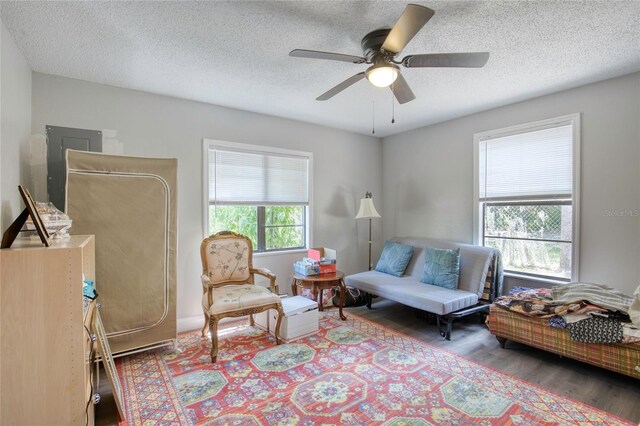 330 Wall Ave, Ormond Beach, FL 32174 - sitting room with a textured ceiling, ceiling fan, and wood finished floors