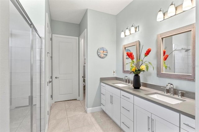 full bath featuring double vanity, tile patterned flooring, a stall shower, and a sink