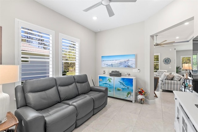 living room featuring light tile patterned flooring, ceiling fan, and recessed lighting
